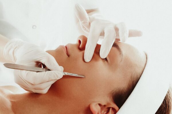 Dermaplaning advanced facial treatment on client's face