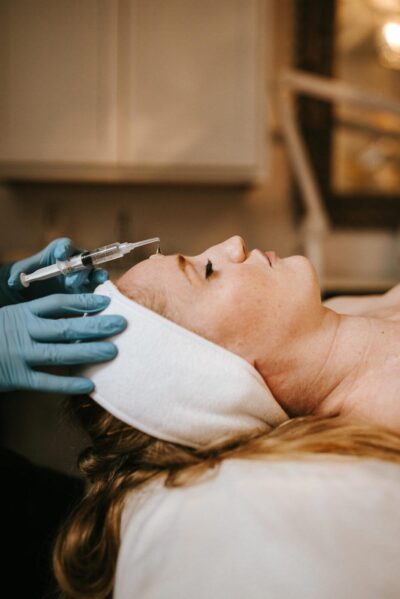 QuannSpa client receiving superficial peel facial treatment