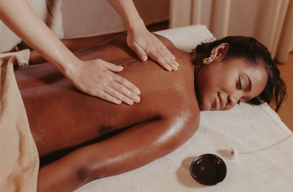 Woman relaxing during Raindrop Body Balance Massage therapy