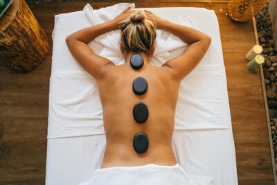 Woman face down during relaxing hot stone massage