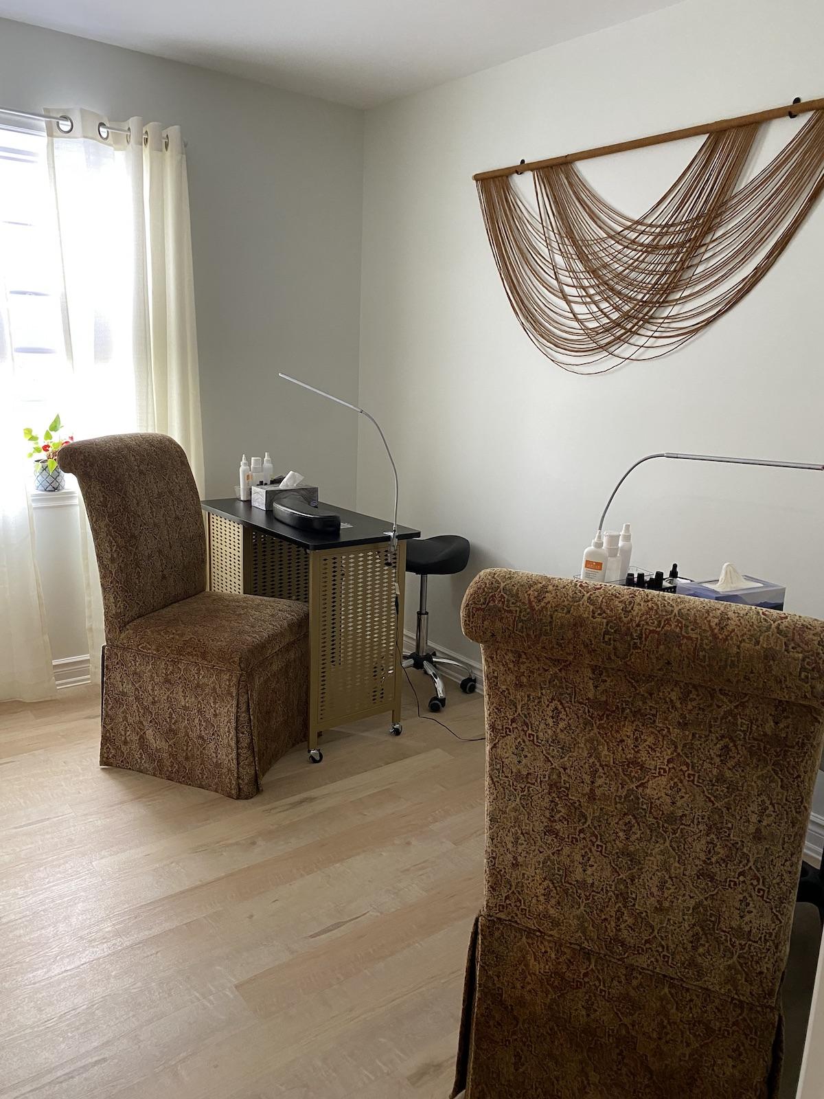 Brown velvet chairs next to manicure stations