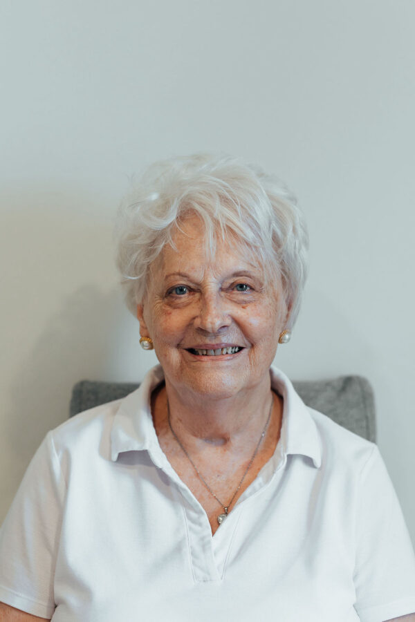 Smiling woman after a QPeel glycolic facial peel treatment